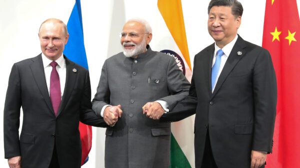 How are India and China benefiting from Russia's cheap oil and gas